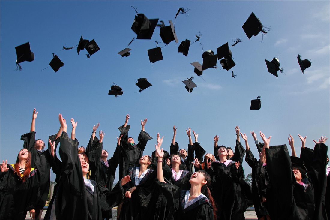 Graduates throwing their caps in celebration