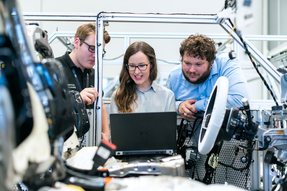 Engineers reviewing technical work together